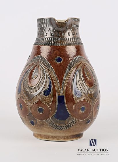 null An ovoid pitcher in glazed stoneware with polychrome decoration of drops, scrolls,...