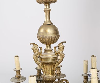  Bronze chandelier with twelve lights, the shaft presents a sphere decorated with...