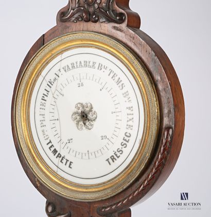 null Barometer in carved natural wood and wood veneer, the round enamel dial is hemmed...