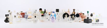 null Lot of about forty-seven glass and plastic perfume bottles of various brands...