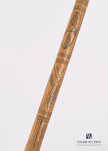 null Wooden and woven wicker cattail with bell, the shaft engraved with geometric,...