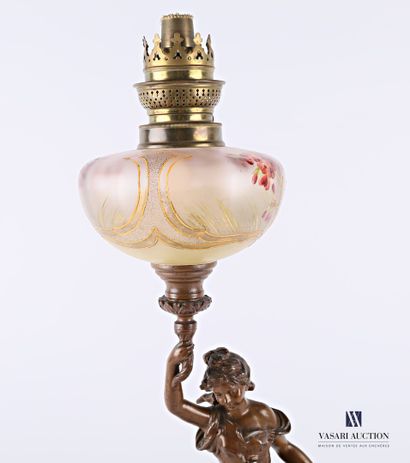  A kerosene lamp standing on a moulded wooden base with an imitation marble patina,...