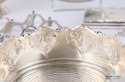 null A silver plated set comprising a napkin ring with an openwork frieze (in its...