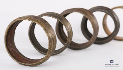null AFRICA

Lot of five ribbed bronze bracelets or shackles, two of which are engraved...