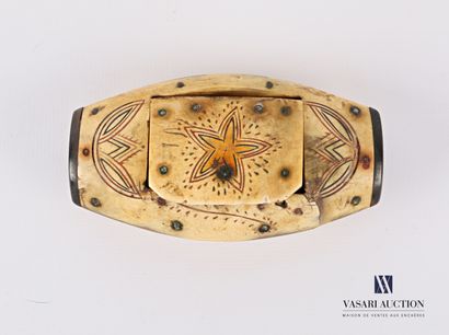 null A horn snuffbox of shuttle shape with engraved and painted decoration of a star...