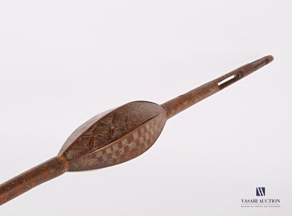 null Wooden cattail with a bell with engraved and carved geometrical and floral motifs...