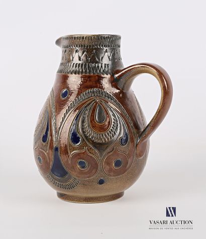null An ovoid pitcher in glazed stoneware with polychrome decoration of drops, scrolls,...