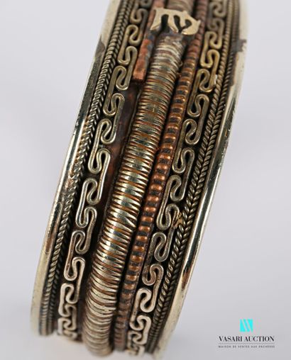 null Set of two bracelets including a metal and copper bracelet decorated with friezes...