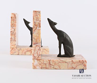 null A pair of bookends featuring two seated deer in regula resting on a right angle...