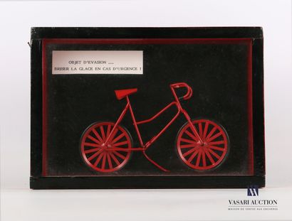 null Lacquered wooden frame presenting a red metal bicycle bearing a label "Object...
