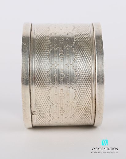 null Silver napkin ring decorated with an engraved medallion flanked by foliage on...