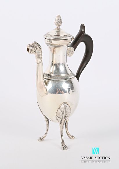 null A silver self-serving coffee pot standing on three arched legs ending in lion...