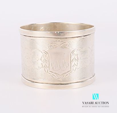 null Silver napkin ring decorated with an engraved medallion flanked by foliage on...