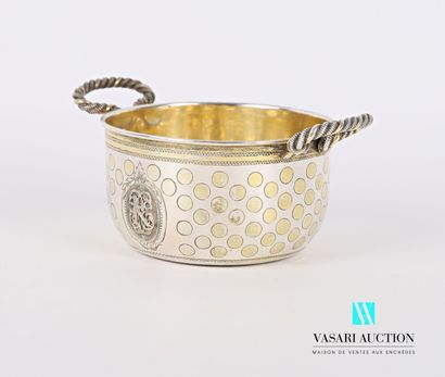null A silver bowl with a flat base, the body decorated with a medallion in relief...