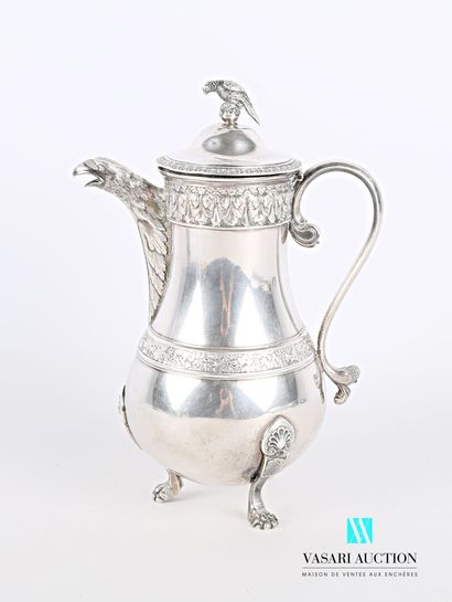 null A silver coffee pot standing on three legs ending in claws, the figured body...