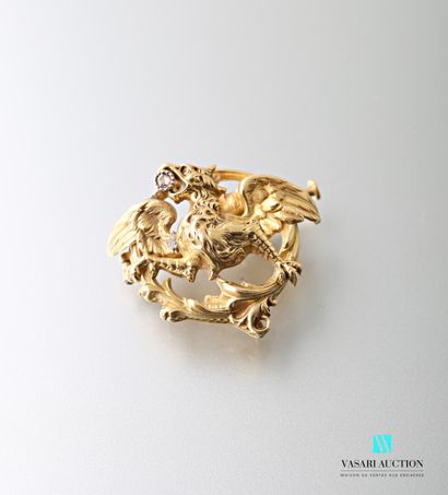 null A yellow gold 750 thousandths round pendant brooch decorated with a chimera...