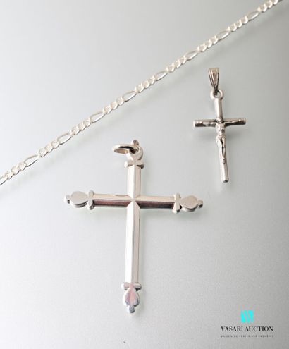 null A silver plated chain, a silver plated cross pendant and a silver cross pendant...