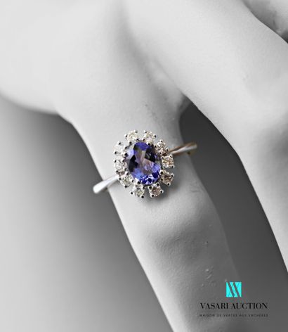 null Ring in white gold 750 thousandth set in its center of a tanzanite of oval size...