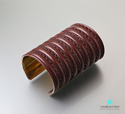 null Copper cuff bracelet decorated with a frieze of wavy lines alternating with...