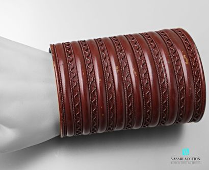 null Copper cuff bracelet decorated with a frieze of wavy lines alternating with...