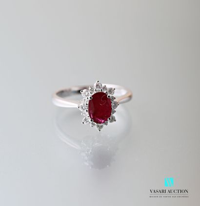 null Ring in white gold 750 thousandth set with a ruby of oval size calibrating 1,05...