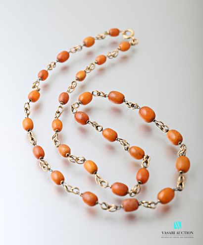 null Necklace in yellow gold 750 thousandths and oval pearls of amber 

Podis gross...