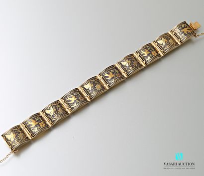 null Bracelet ruban en or jaune 750 millièmes formé de dix plaques d'ébène à décor...