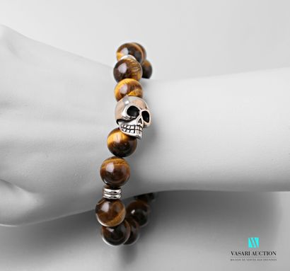 null Bracelet on extensible cord decorated with balls eye of tiger decorated with...