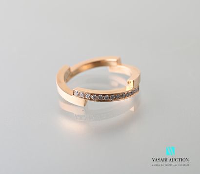 null Ring in pink gold 750 thousandths formed of four parts, one paved with 13 diamonds...