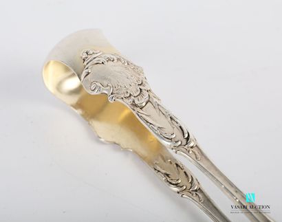 null Silver sugar tongs, the arms surmounted by blind cartouches underlined by foliage...