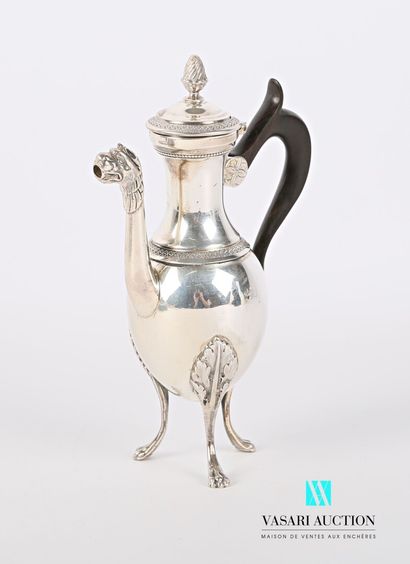 null A silver self-serving coffee pot standing on three arched legs ending in lion...