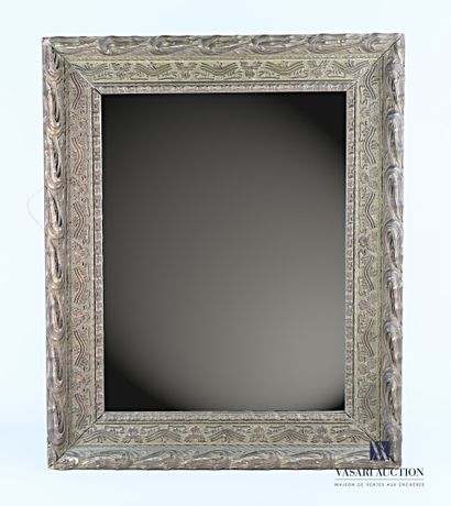 null Wood and stucco mirror, molded, carved and bronzed with scrolled leaves and...