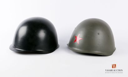 null Two Warsaw Pact type helmets: one khaki with red star and one black, ABE, 2...