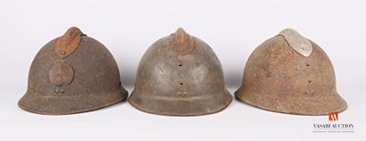 null Three helmet shells Adrian model 1926, interior and chinstraps missing, wear,...