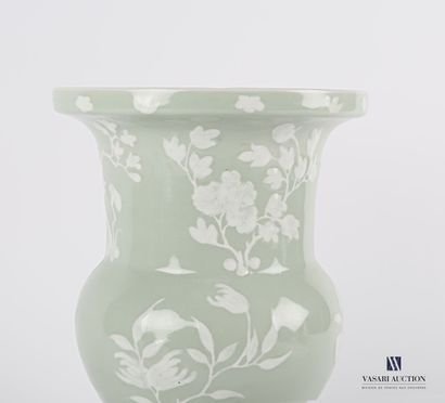 null CHINA 

Celadon porcelain gü shape vase with decoration left in reserve. 

20th...