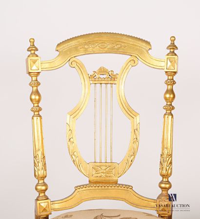 null Pair of moulded, carved and gilded natural wood music chairs, the backs in the...