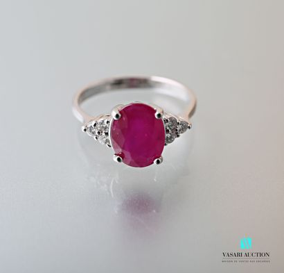 null Ring in white gold 750 thousandth set in its center of a ruby of oval size calibrating...