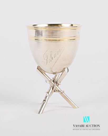 null Silver egg cup on a tripod base, marked Jehan and hemmed with a net on the body...