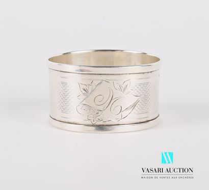 null A silver napkin ring with the number M in a cartouche, the body hemmed with...