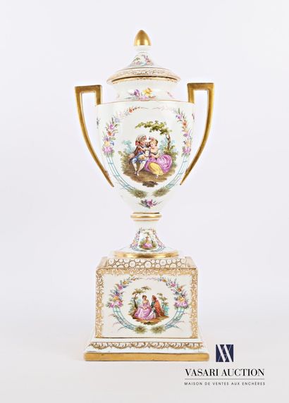 null White porcelain urn with gold highlights, the body with polychrome decoration...