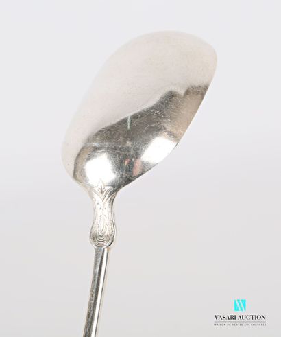 null A silver serving spoon, the handle in the Russian style, the sides decorated...