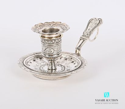 null Silvered bronze hand candlestick, the basin decorated with scalloped leafy garlands,...