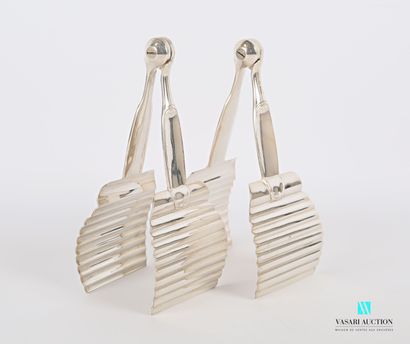 null Pair of silver plated asparagus tongs, the dishes decorated with ribs, the arms...