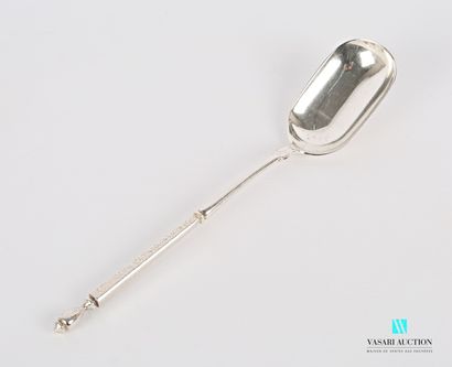 null A silver serving spoon, the handle in the Russian style, the sides decorated...