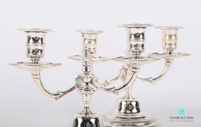 null A pair of silver plated bronze table ends standing on a round base with a doucine...