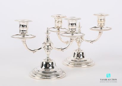 null A pair of silver plated bronze table ends standing on a round base with a doucine...