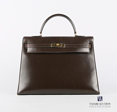 null HERMES PARIS 

Kelly Sellier bag in brown box

Signature Hermès Paris

(1.5...
