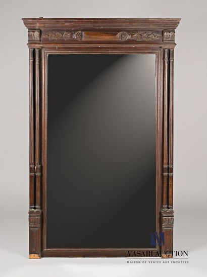 null Mirror in molded and carved natural wood, the mirror of rectangular shape flaunted...
