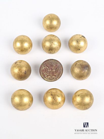 null A set of nine brass buttons semi-spherical. It is attached a button decorated...