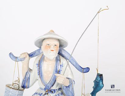 null White porcelain subject tinted blue and gold representing a fisherman supporting...